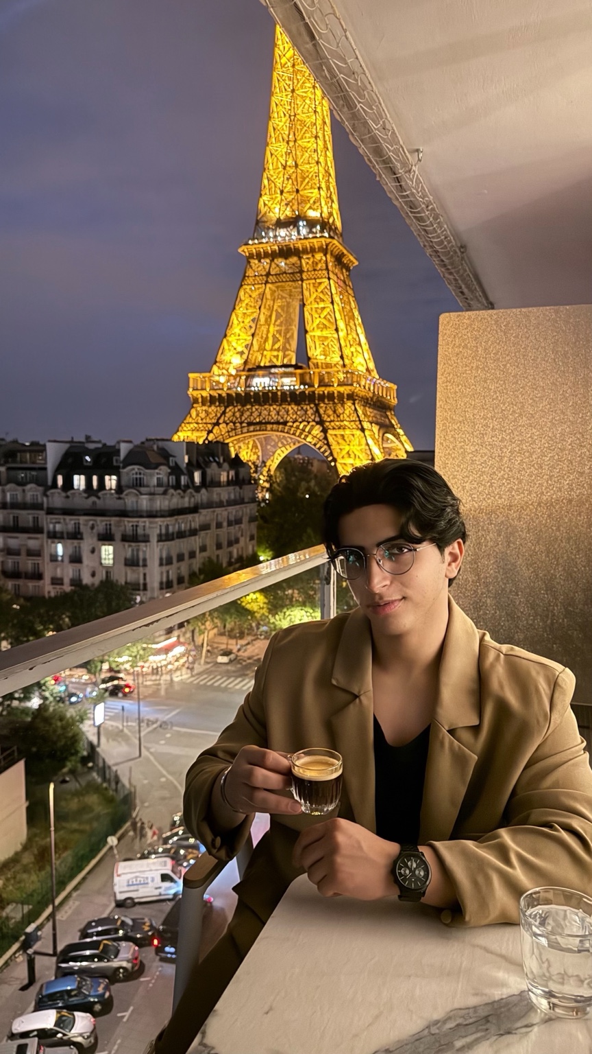 Abdullah at the Eiffel Tower at night